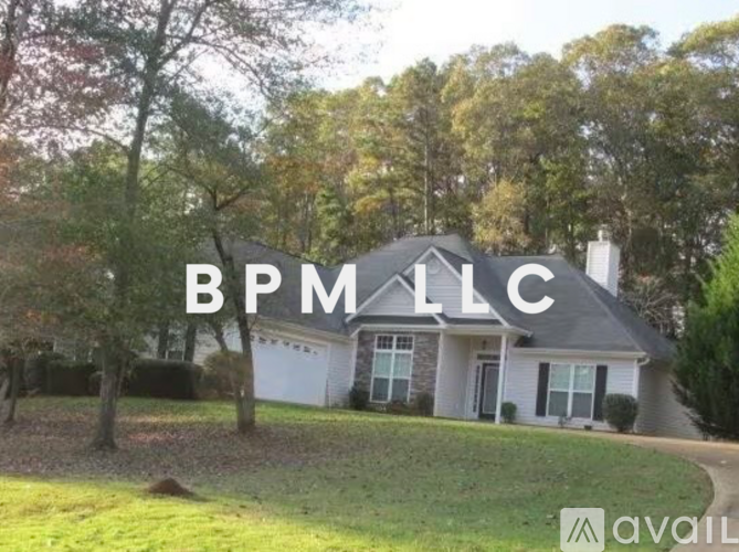 A house with the text "BPM LLC" superimposed on it.