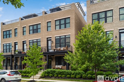 A building with a car parked in front of it.