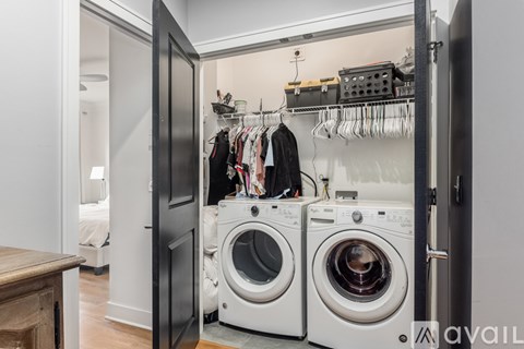 A laundry room with a washer and dryer in it.