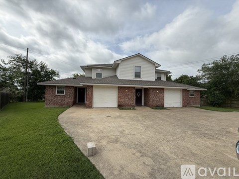 A house with a garage is for sale.