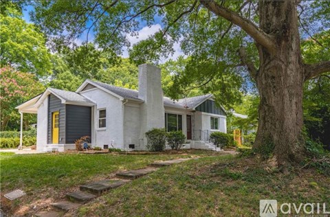 A house with a yellow door is for sale.