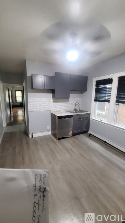 A kitchen with a sink and a window.