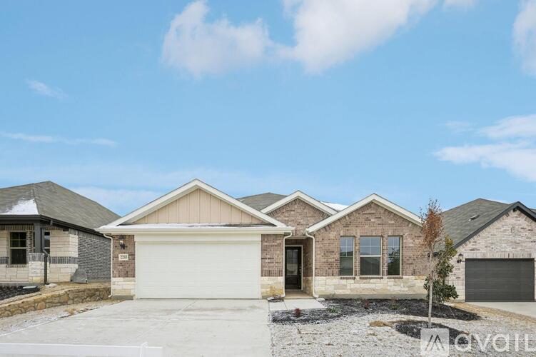 A house with a garage is available for sale.