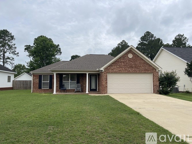 A house with a brick facade and a grey roof.