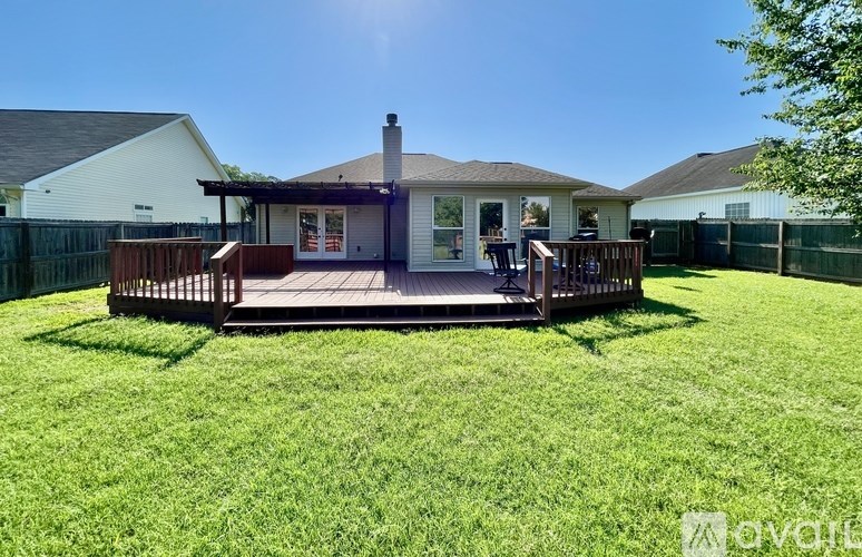 A house with a deck in the backyard.