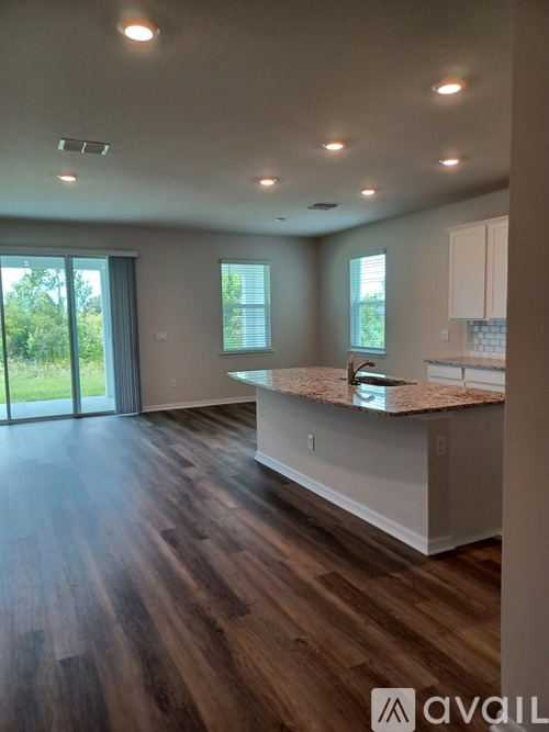A kitchen with a countertop and cabinets is shown.