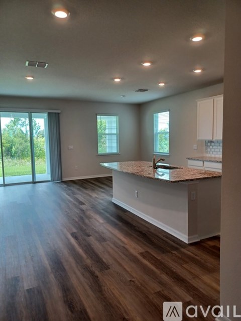 A kitchen with a countertop and cabinets is shown.