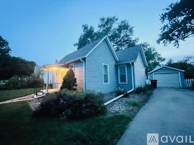 A house with a driveway and a garage is shown.