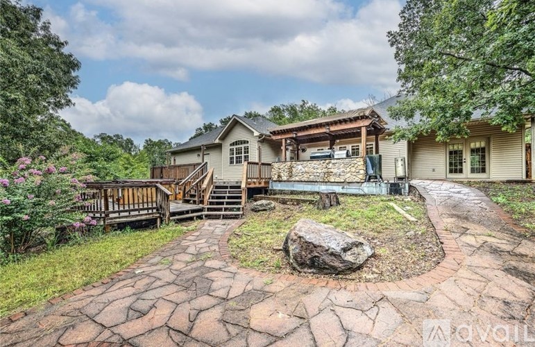 A house with a stone pathway leading to the front door.