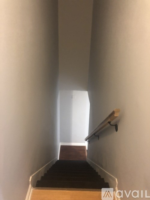 A staircase with a light at the end.