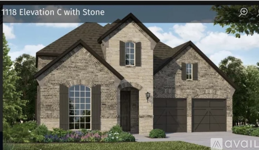 A house with stone exterior and a stone garage door.