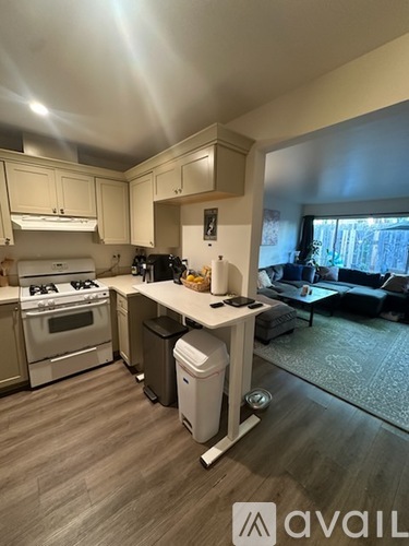 A kitchen with a stove top oven and a dishwasher.