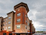 a tall brick building with a roof on top of it