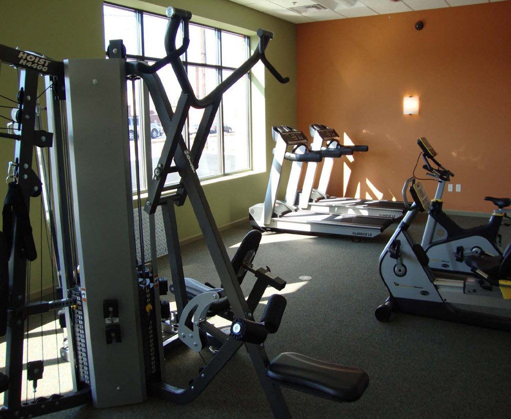 a gym with some exercise equipment in it