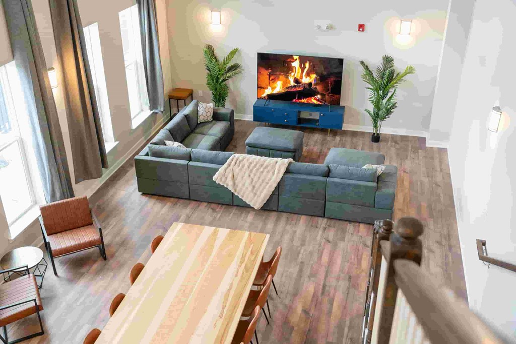 A living room with a fireplace and a couch.