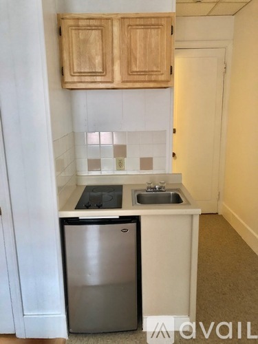 A small kitchen with a sink and a dishwasher.