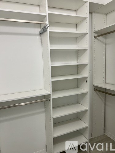 A white shelving unit with metal supports.