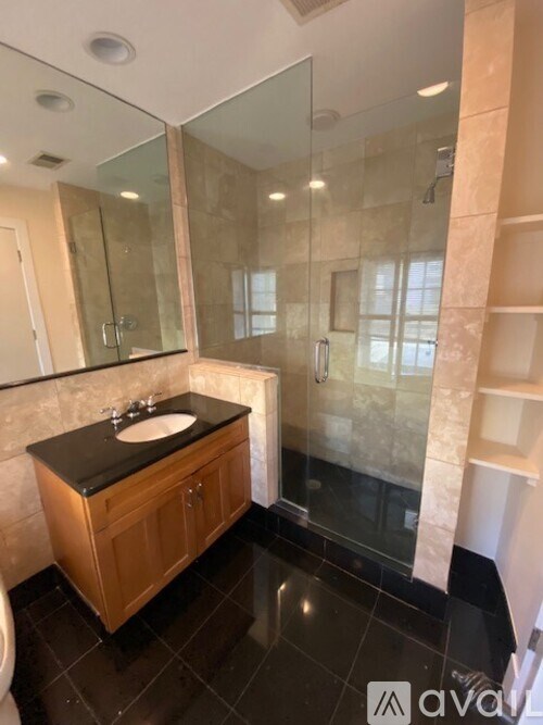 A bathroom with a sink and mirror.