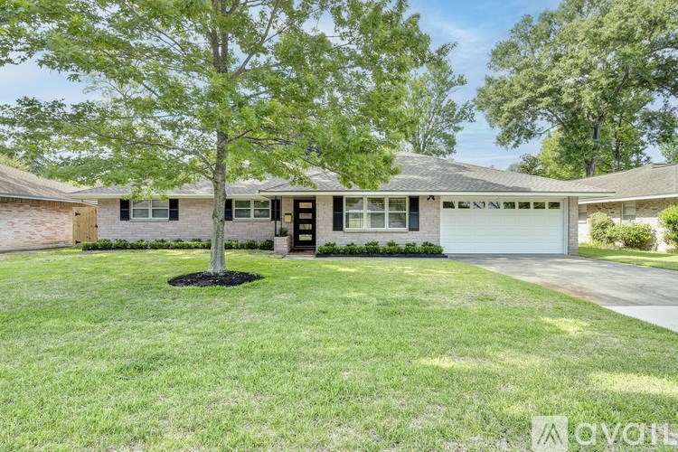 A house with a tree in front of it.