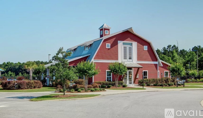 A red barn-like building with a blue roof and white trim.