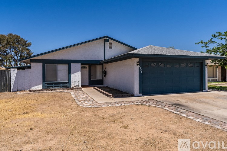A two-story house with a garage is available for rent.