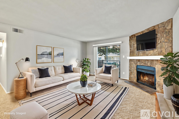 A living room with a fireplace and a couch.