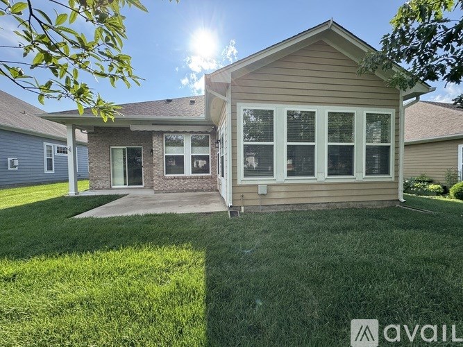 A house with a lawn in front of it is for sale.