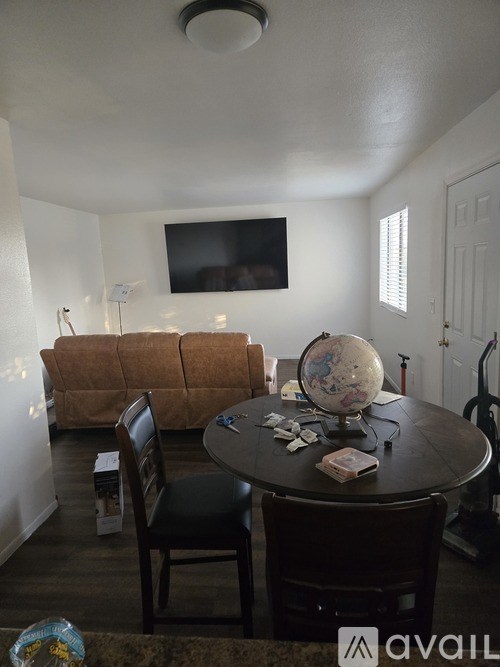 A white closet with a bag and a shoe on the floor.