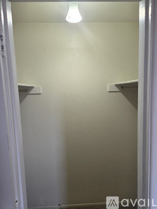 A small, empty room with a light on.