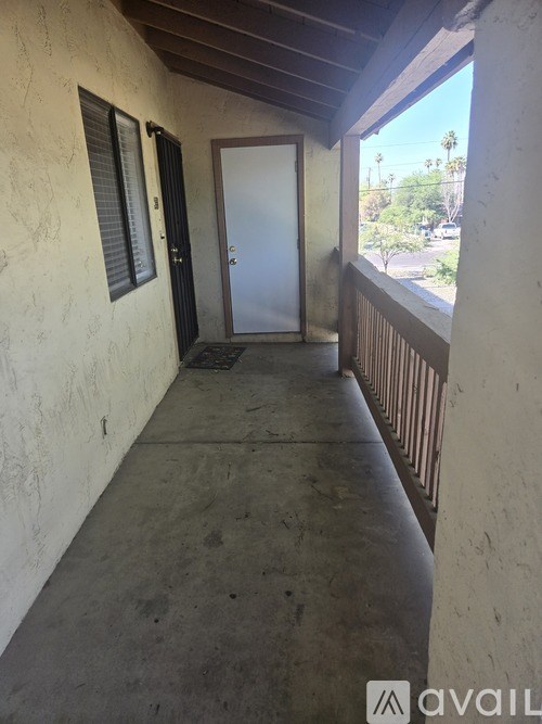 A balcony with a door and a window.