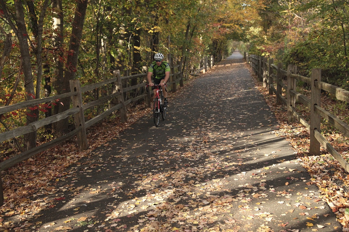 a man riding a bike down a trail