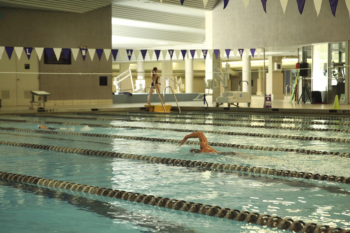 a swimmer in a swimming pool in a gym