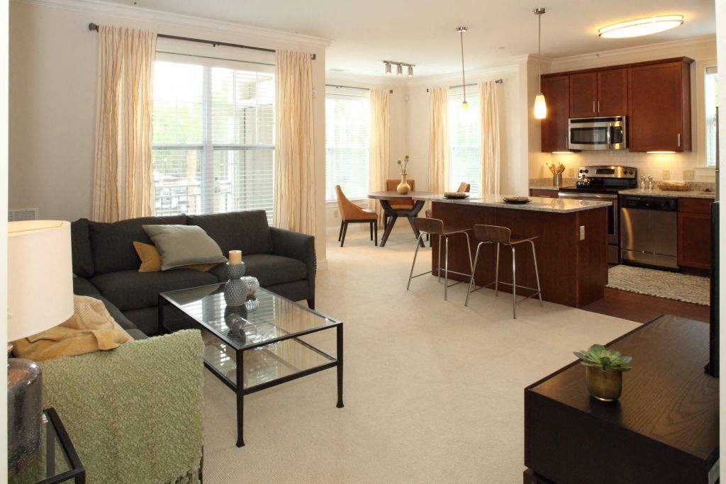 the living room and kitchen of an apartment