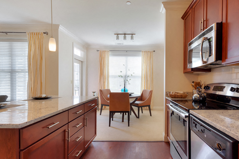 a kitchen and dining room with a table and chairs