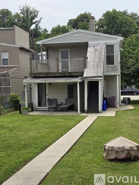 A house with a porch and a covered patio.