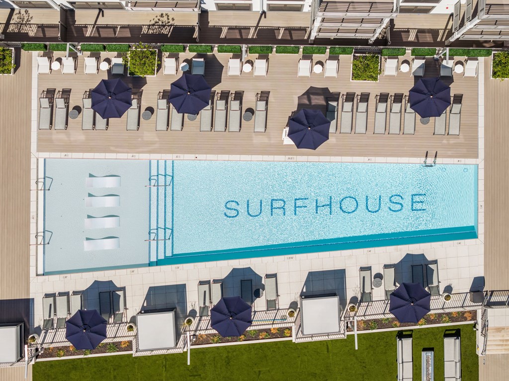 A large swimming pool with the word "SURFHOUSE" written on it.