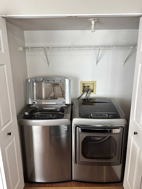 A small kitchen with a stainless steel dishwasher and oven.