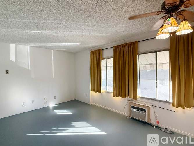 A room with a blue floor and white walls.
