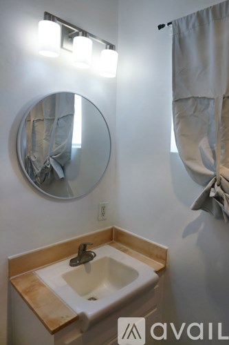 A bathroom sink with a mirror above it.