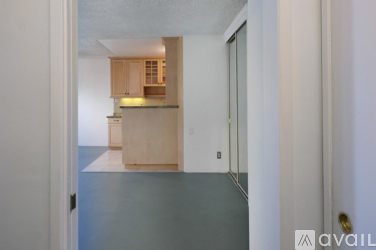 A hallway leading to a kitchen area.