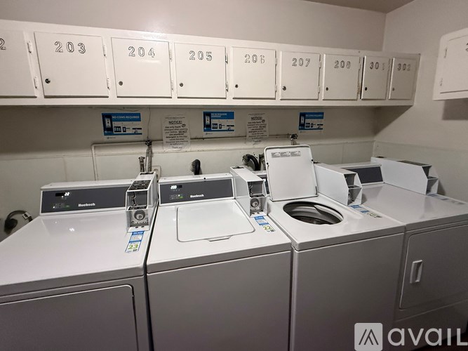 A row of washing machines in a laundromat.