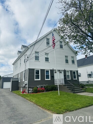 A house with a tree in front of it.
