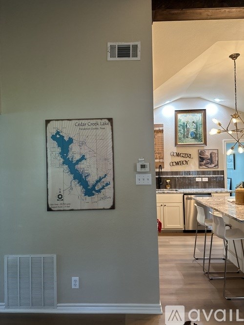 A map of Cedar Creek Lake is hanging on a wall.