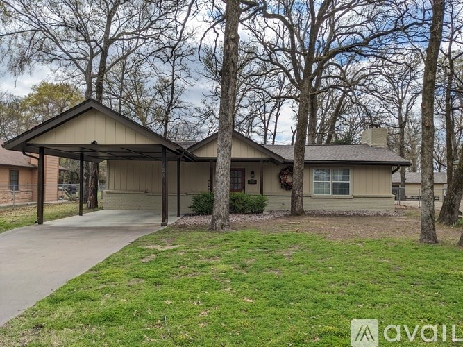 A house with a covered patio is for sale.