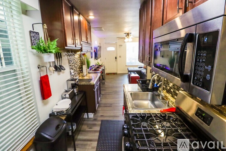 A kitchen with a stove top oven and microwave.