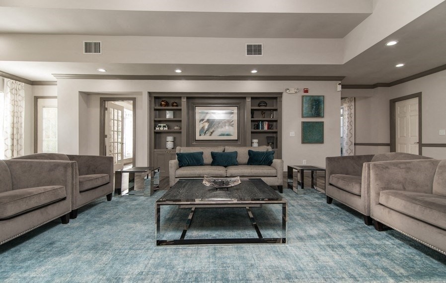 a living room with couches and a coffee table