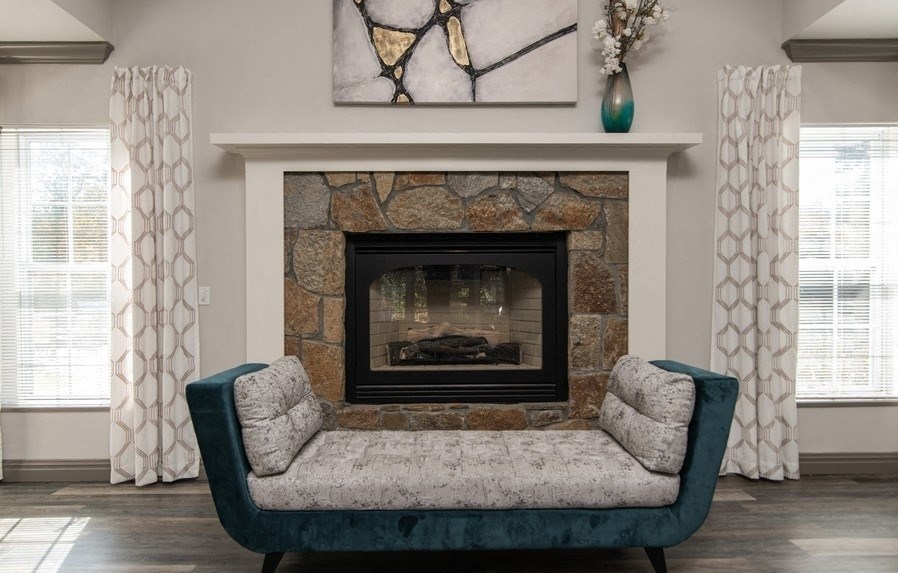 a living room with a fireplace and a couch