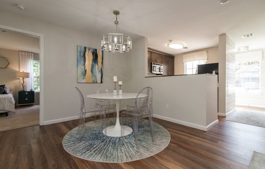 a dining room with a table and a chandelier