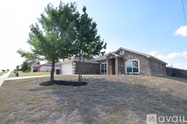 A house with a tree in front of it.