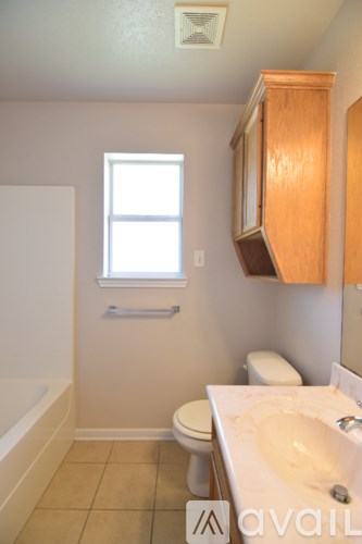 A room with a window and a door.